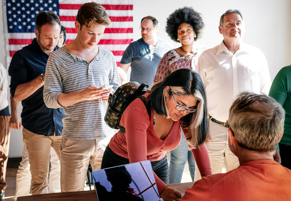 diverse-people-queuing-at-a-polling-place-4Y474X2.jpg